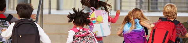 Children running into school